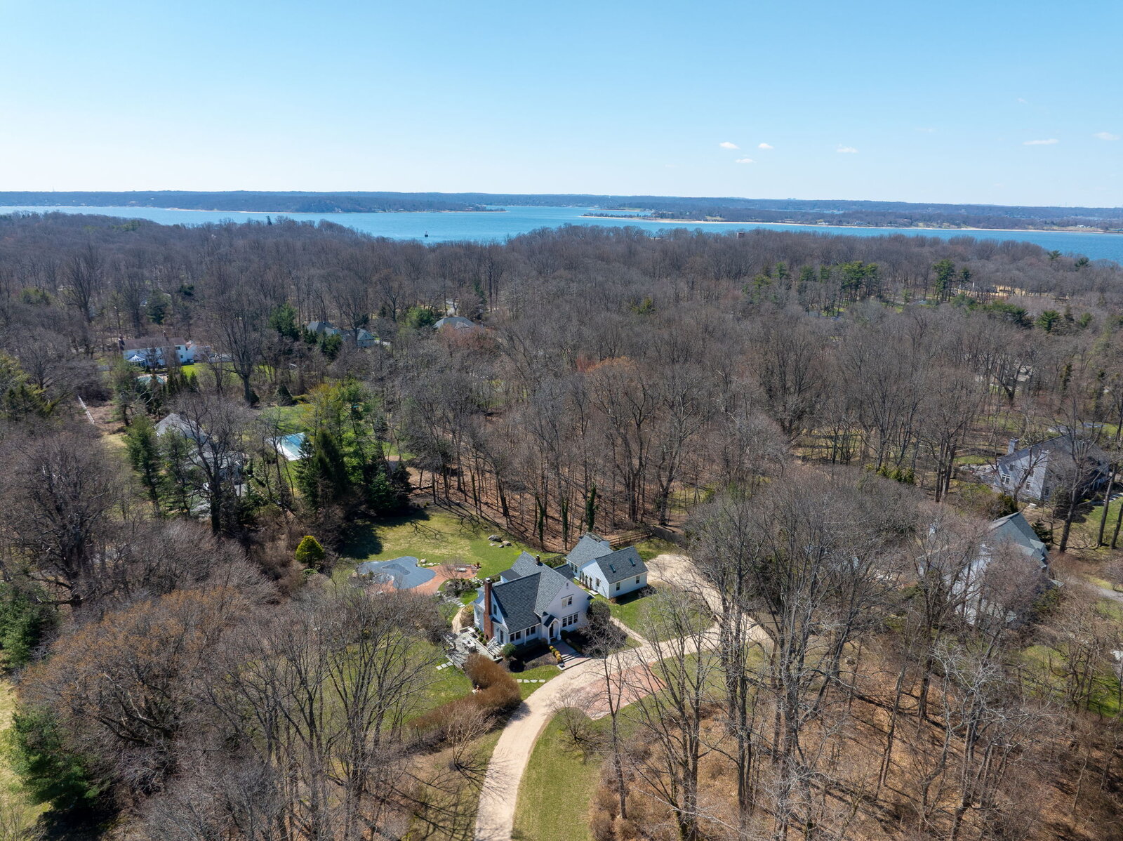 Aerial showing water views beyond property