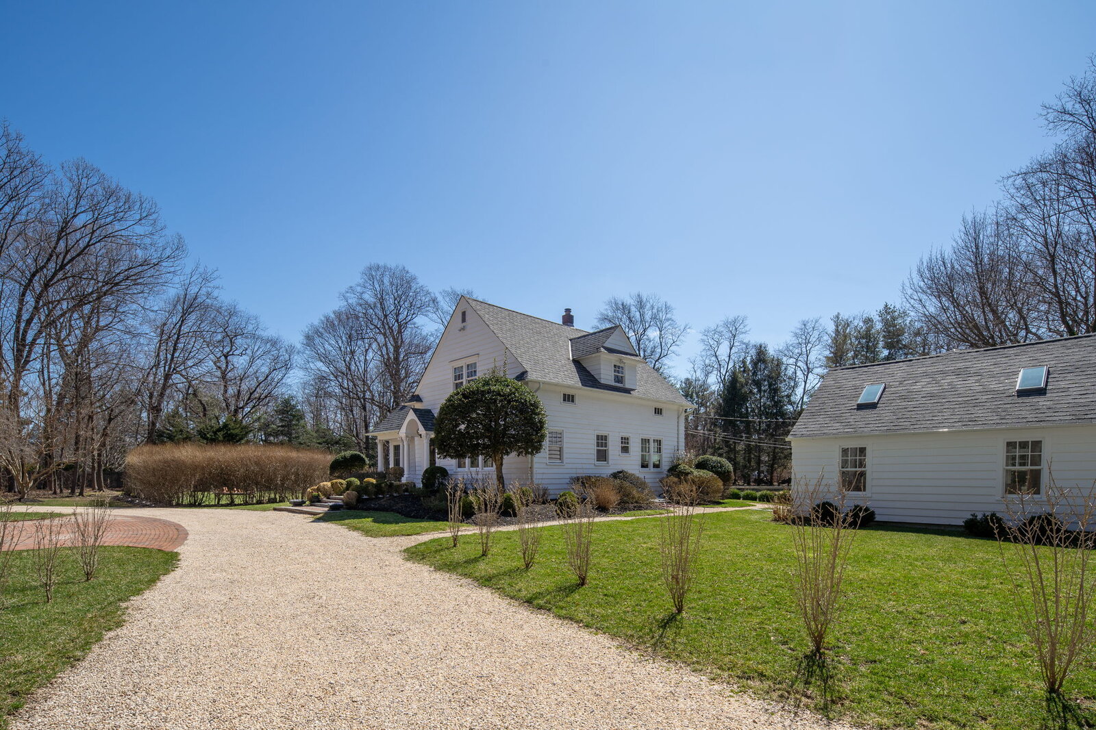 Classic Nantucket-style colonial with white clapboard