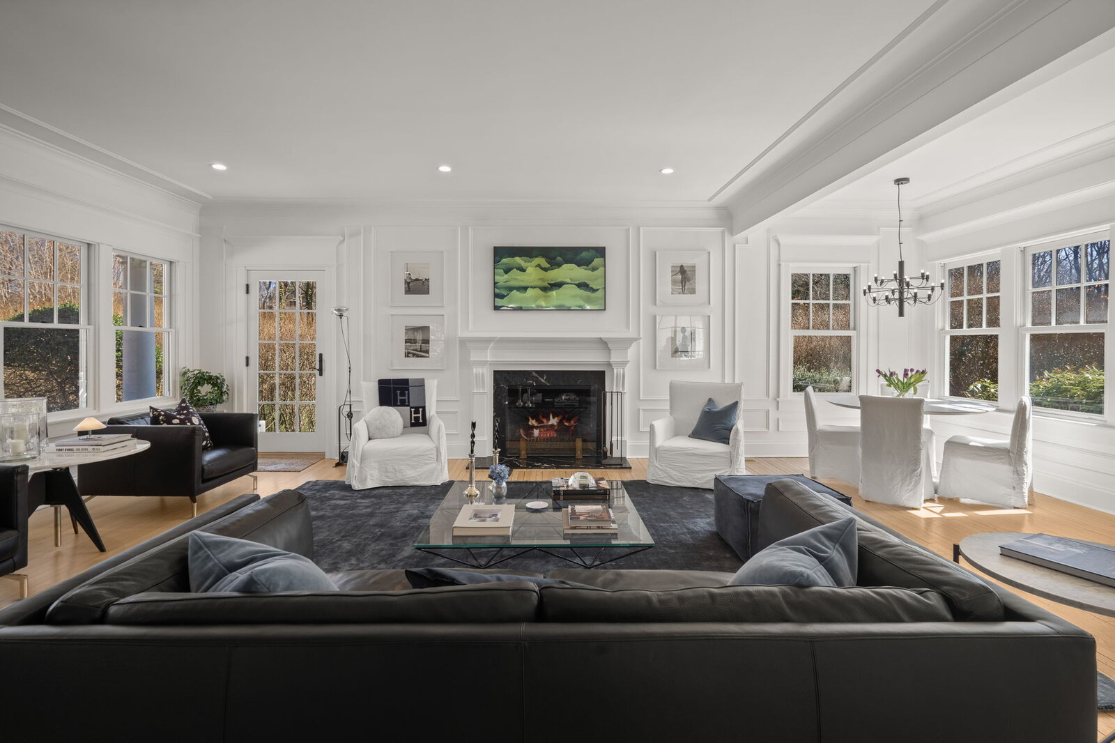 Elegant living room with white paneling and fireplace